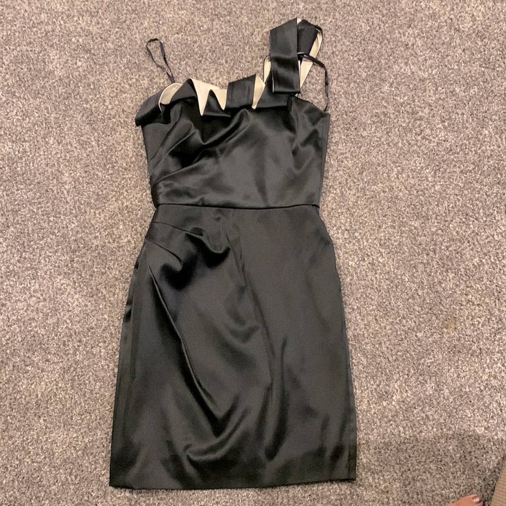 One shoulder knee length dress, black with cream colored accent on top.